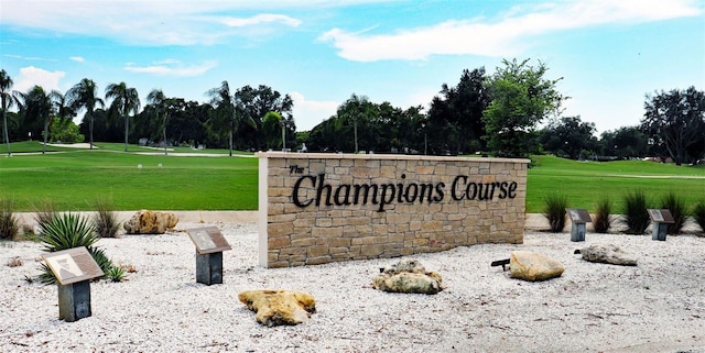 8142 Misty Oaks Blvd, Sarasota, FL 34243 - community sign with view of scattered trees, a lawn, and view of golf course