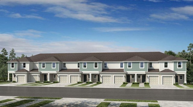 multi unit property with an attached garage, driveway, and a residential view