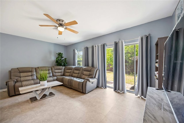 1122 42nd Ter E, Bradenton, FL 34208 - living room with healthy amount of natural light, ceiling fan, and light tile patterned floors
