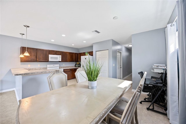 1122 42nd Ter E, Bradenton, FL 34208 - dining room with baseboards and recessed lighting