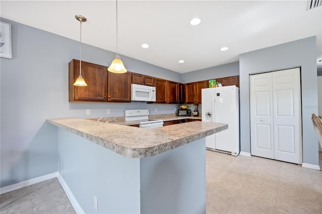 1122 42nd Ter E, Bradenton, FL 34208 - kitchen featuring white appliances, light countertops, a peninsula, baseboards, and pendant lighting