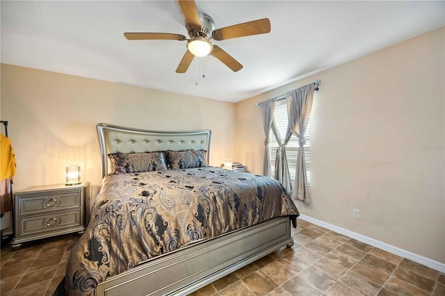 1122 42nd Ter E, Bradenton, FL 34208 - bedroom featuring baseboards and a ceiling fan