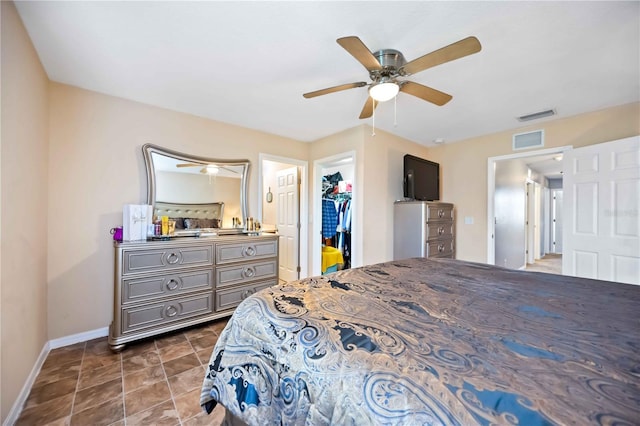 1122 42nd Ter E, Bradenton, FL 34208 - bedroom featuring baseboards, a spacious closet, ceiling fan, and a closet
