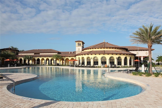 13587 Vancanza Dr, Venice, FL 34293 - community pool featuring a patio
