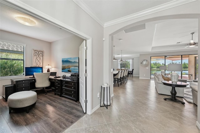 13587 Vancanza Dr, Venice, FL 34293 - interior space with arched walkways, ornamental molding, baseboards, and ceiling fan