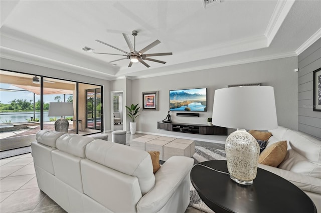 13587 Vancanza Dr, Venice, FL 34293 - living room featuring crown molding, a raised ceiling, a ceiling fan, and visible vents