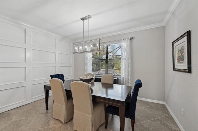 13587 Vancanza Dr, Venice, FL 34293 - dining area featuring tile patterned flooring, ornamental molding, a decorative wall, baseboards, and a notable chandelier