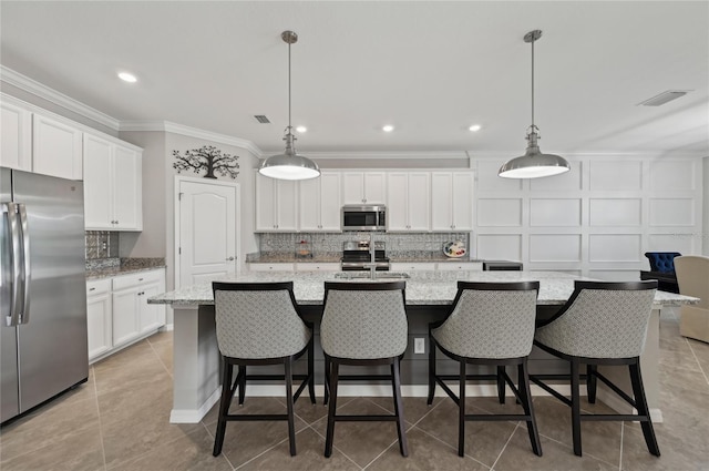 13587 Vancanza Dr, Venice, FL 34293 - kitchen featuring backsplash, appliances with stainless steel finishes, ornamental molding, and visible vents