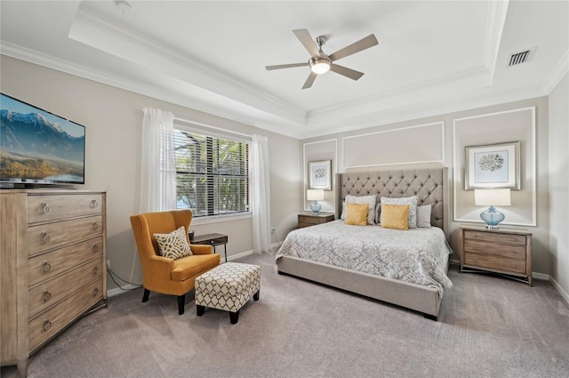 13587 Vancanza Dr, Venice, FL 34293 - bedroom featuring visible vents, crown molding, a raised ceiling, baseboards, and carpet flooring