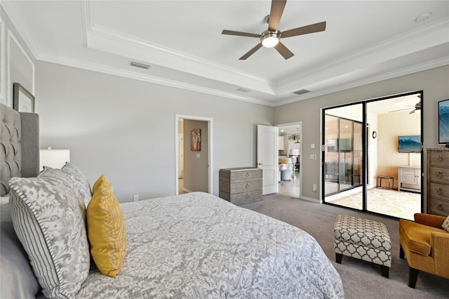 13587 Vancanza Dr, Venice, FL 34293 - bedroom featuring visible vents, carpet, a tray ceiling, and access to exterior