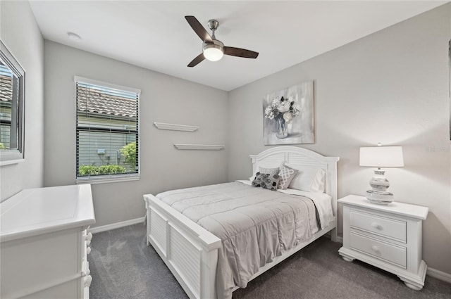 13587 Vancanza Dr, Venice, FL 34293 - bedroom featuring baseboards, a ceiling fan, and dark colored carpet