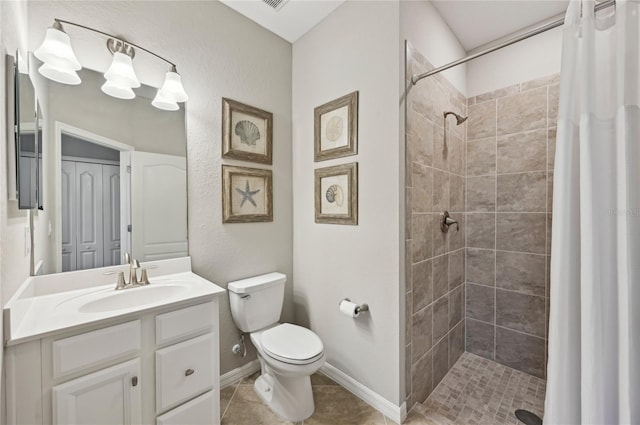 13587 Vancanza Dr, Venice, FL 34293 - bathroom with vanity, tile patterned flooring, a tile shower, and toilet