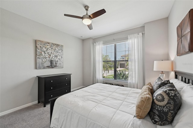 13587 Vancanza Dr, Venice, FL 34293 - bedroom featuring baseboards, light carpet, and ceiling fan