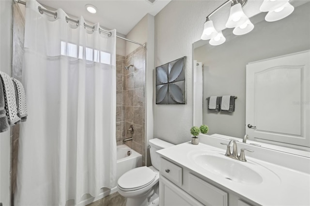 13587 Vancanza Dr, Venice, FL 34293 - bathroom featuring vanity, shower / bath combo with shower curtain, and toilet