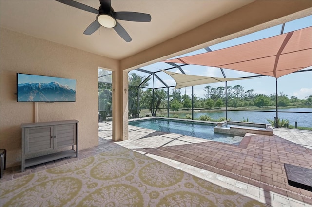 13587 Vancanza Dr, Venice, FL 34293 - view of pool with a pool with connected hot tub, a water view, a patio area, a ceiling fan, and a lanai