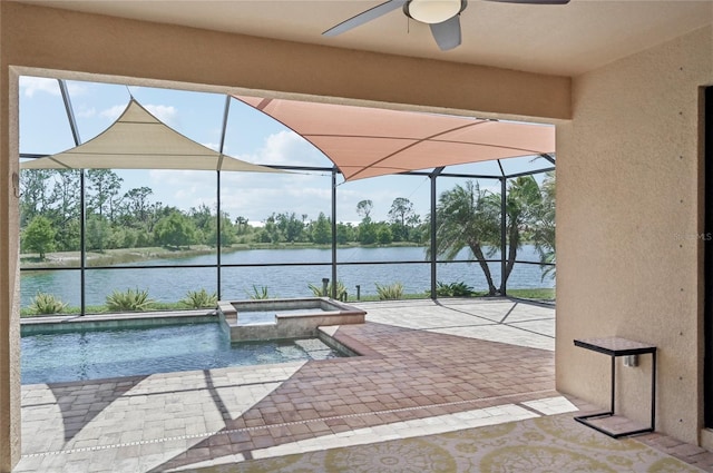 13587 Vancanza Dr, Venice, FL 34293 - view of patio / terrace featuring a ceiling fan, glass enclosure, a water view, and a pool with connected hot tub