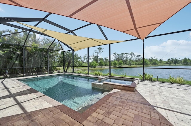 13587 Vancanza Dr, Venice, FL 34293 - view of swimming pool featuring glass enclosure, a water view, a pool with connected hot tub, and a patio area