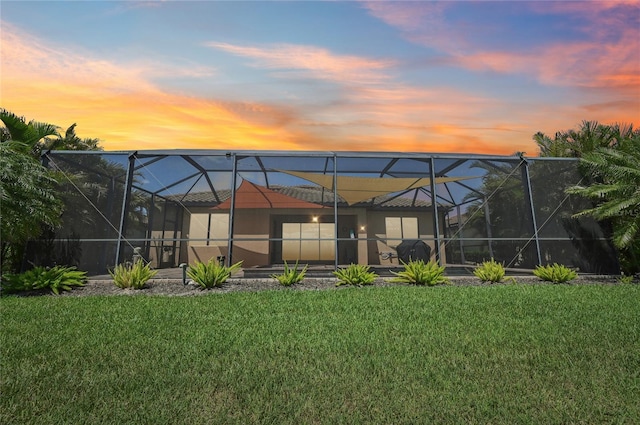 13587 Vancanza Dr, Venice, FL 34293 - back of property featuring a lawn and a lanai