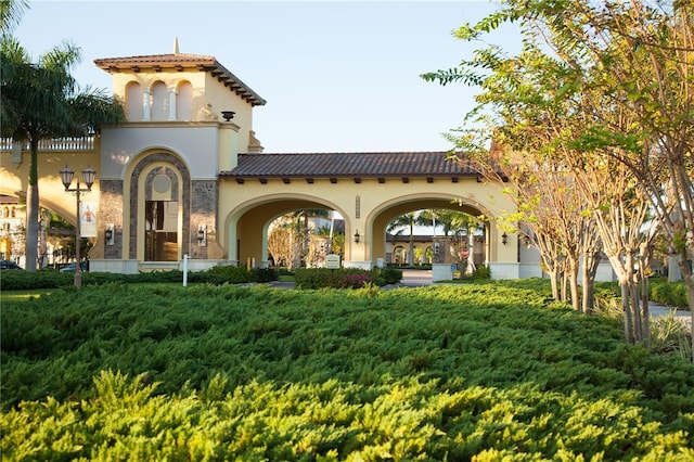 13587 Vancanza Dr, Venice, FL 34293 - back of property with french doors, a tile roof, and stucco siding