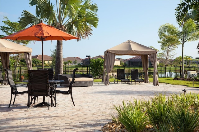 13587 Vancanza Dr, Venice, FL 34293 - exterior space with a water view, a gazebo, and fence
