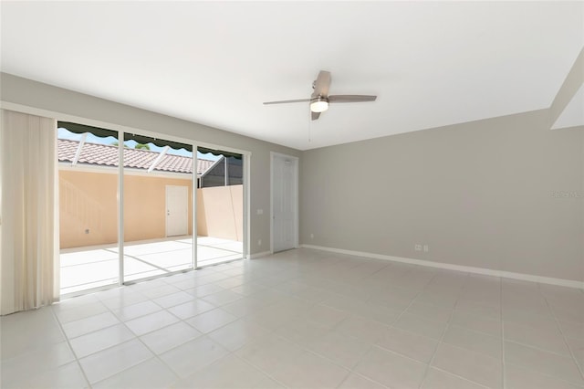 unfurnished bedroom with access to outside, baseboards, a ceiling fan, and light tile patterned floors