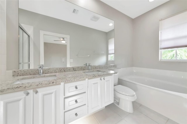 full bathroom featuring a sink, tile patterned floors, a garden tub, and visible vents