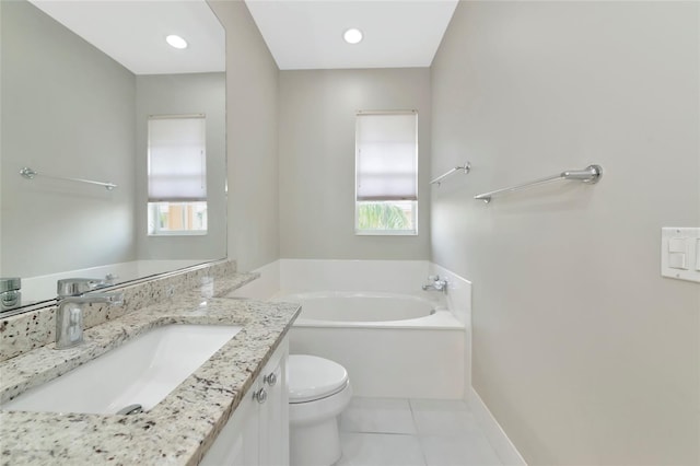 full bath with tile patterned flooring, a garden tub, toilet, and a wealth of natural light