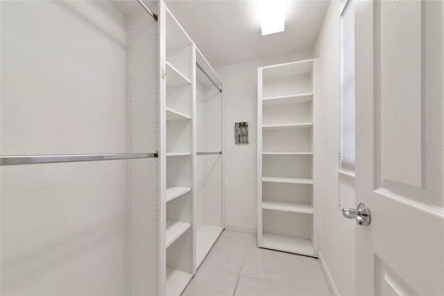 spacious closet with tile patterned flooring