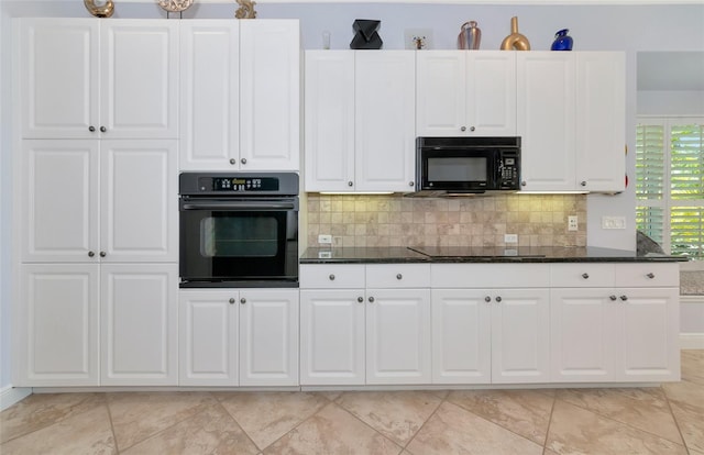 7624 Boltons Ct, Bradenton, FL 34201 - kitchen with black appliances, decorative backsplash, and white cabinets