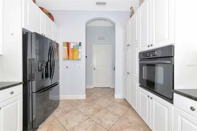 7624 Boltons Ct, Bradenton, FL 34201 - kitchen featuring black appliances, arched walkways, white cabinets, and baseboards