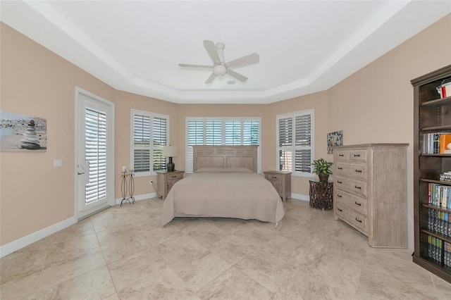 7624 Boltons Ct, Bradenton, FL 34201 - bedroom featuring a raised ceiling, access to outside, a ceiling fan, and baseboards