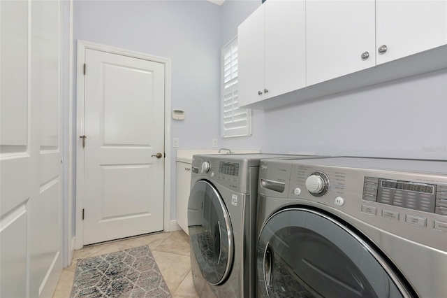 7624 Boltons Ct, Bradenton, FL 34201 - washroom with cabinet space, washing machine and clothes dryer, and light tile patterned floors