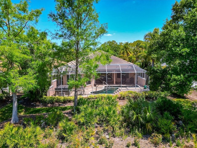 7624 Boltons Ct, Bradenton, FL 34201 - back of house featuring a patio, an outdoor pool, a tiled roof, and a lanai