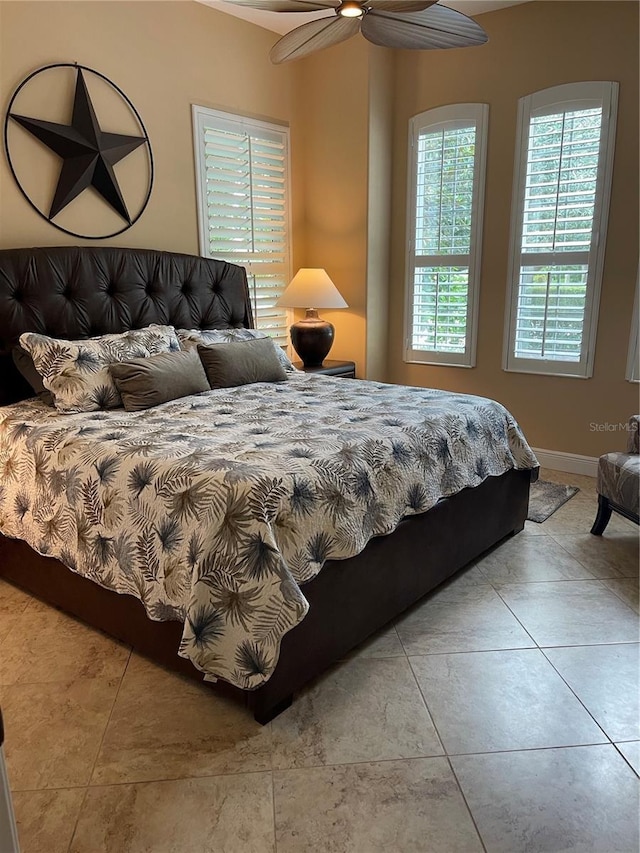7624 Boltons Ct, Bradenton, FL 34201 - tiled bedroom featuring baseboards and a ceiling fan