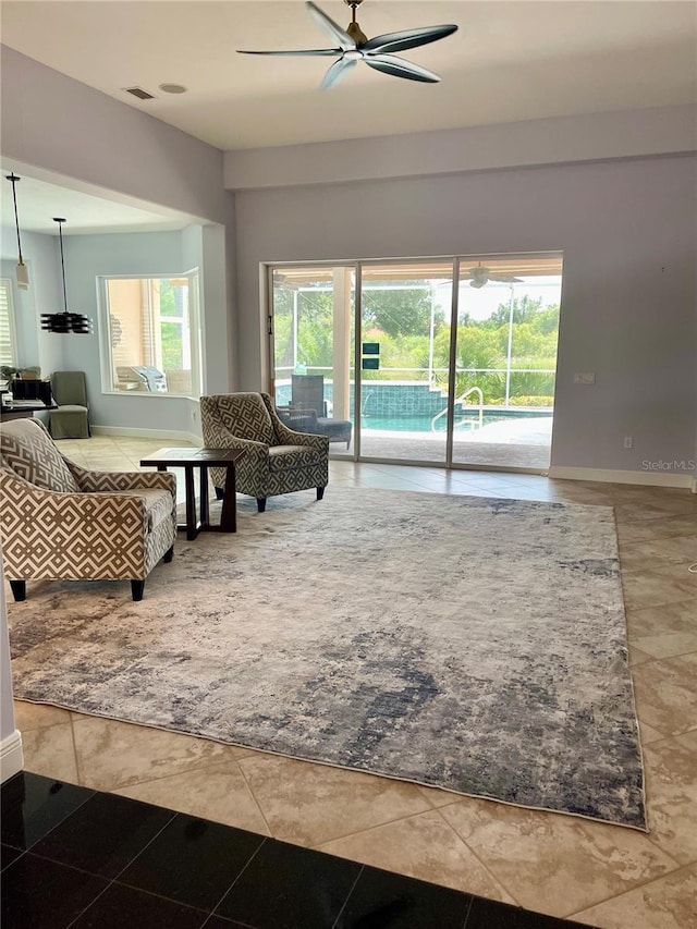 7624 Boltons Ct, Bradenton, FL 34201 - living area with a ceiling fan and plenty of natural light