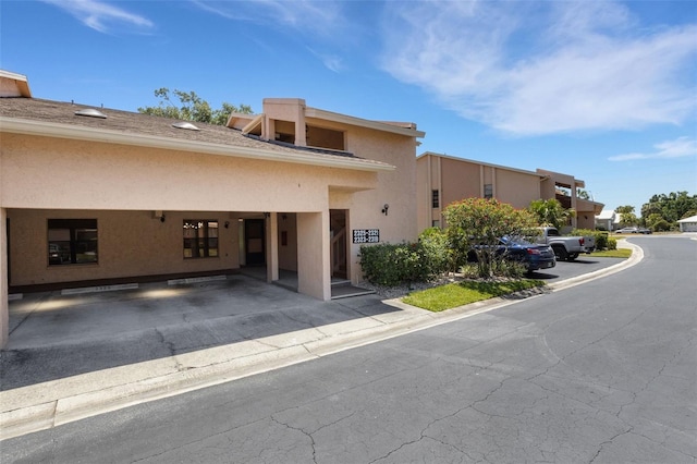 2319 Beneva Ter Unit 2284, Sarasota, FL 34232 - view of property featuring covered parking