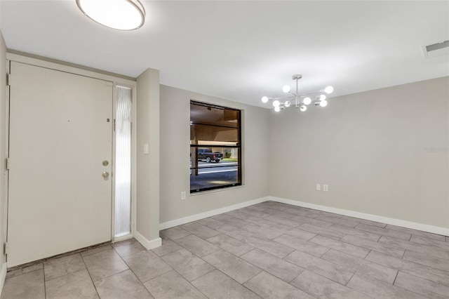 2319 Beneva Ter Unit 2284, Sarasota, FL 34232 - entrance foyer featuring an inviting chandelier, baseboards, light tile patterned floors, and visible vents