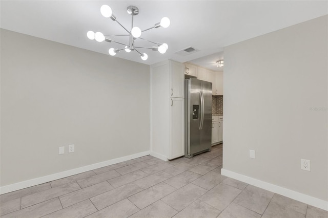 2319 Beneva Ter Unit 2284, Sarasota, FL 34232 - unfurnished room with light tile patterned floors, baseboards, visible vents, and an inviting chandelier