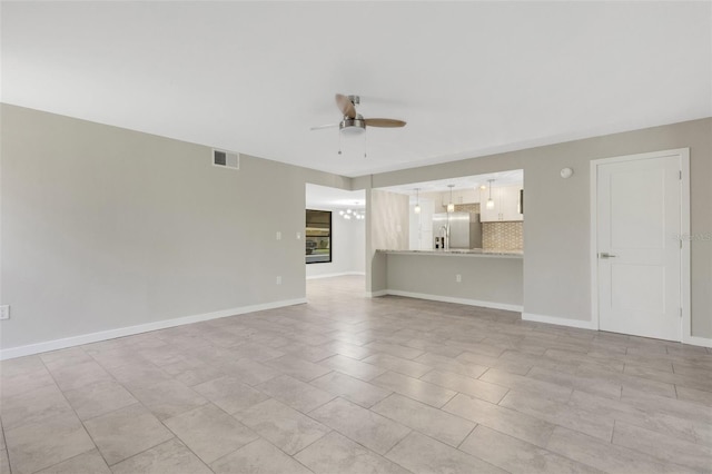 2319 Beneva Ter Unit 2284, Sarasota, FL 34232 - unfurnished living room with visible vents, baseboards, and ceiling fan