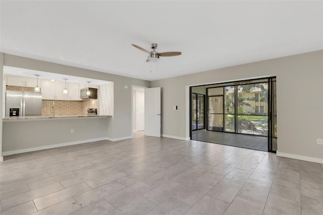 2319 Beneva Ter Unit 2284, Sarasota, FL 34232 - unfurnished living room with a ceiling fan and baseboards