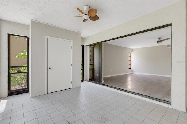 2319 Beneva Ter Unit 2284, Sarasota, FL 34232 - spare room with light tile patterned floors and ceiling fan