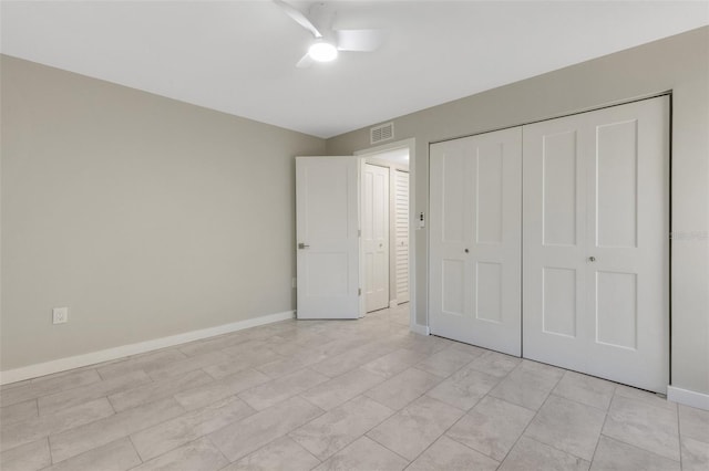 2319 Beneva Ter Unit 2284, Sarasota, FL 34232 - unfurnished bedroom featuring baseboards, visible vents, ceiling fan, and a closet