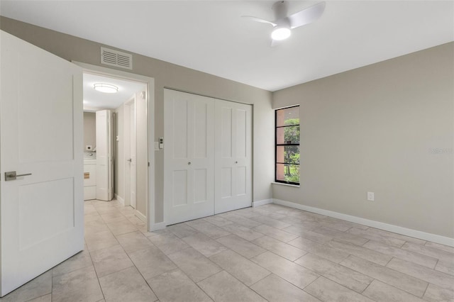 2319 Beneva Ter Unit 2284, Sarasota, FL 34232 - unfurnished bedroom with a ceiling fan, visible vents, baseboards, a closet, and light tile patterned flooring
