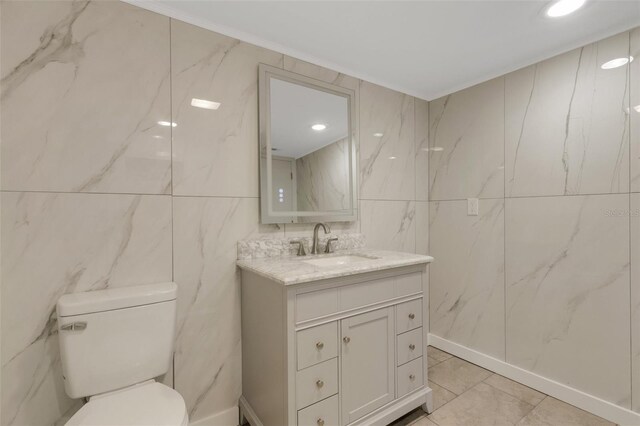 2319 Beneva Ter Unit 2284, Sarasota, FL 34232 - bathroom with vanity, toilet, and tile walls