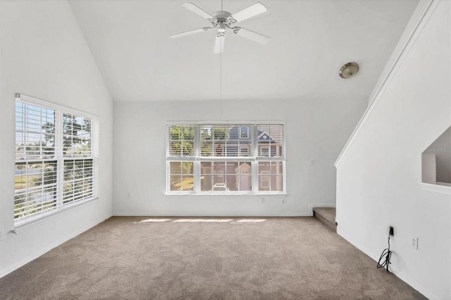 unfurnished living room featuring a healthy amount of sunlight, carpet floors, and a ceiling fan