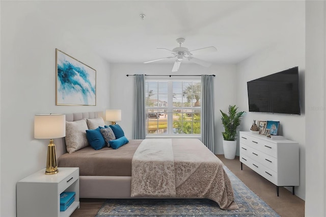 bedroom with ceiling fan and carpet flooring