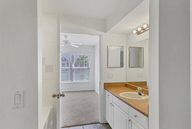 full bathroom featuring a ceiling fan, tile patterned floors, and vanity