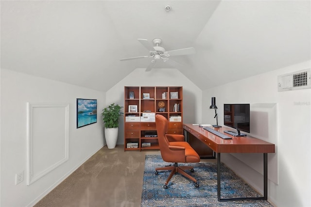 office area featuring carpet flooring, a ceiling fan, baseboards, lofted ceiling, and visible vents