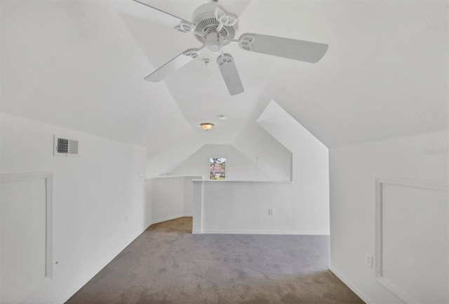 bonus room featuring visible vents, carpet, ceiling fan, and lofted ceiling