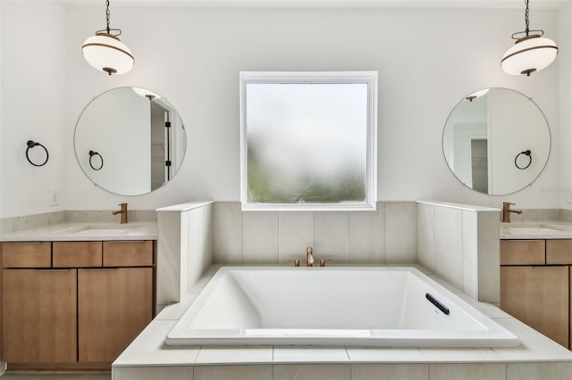 3113 W Nassau St, Tampa, FL 33607 - bathroom featuring two vanities and tiled tub